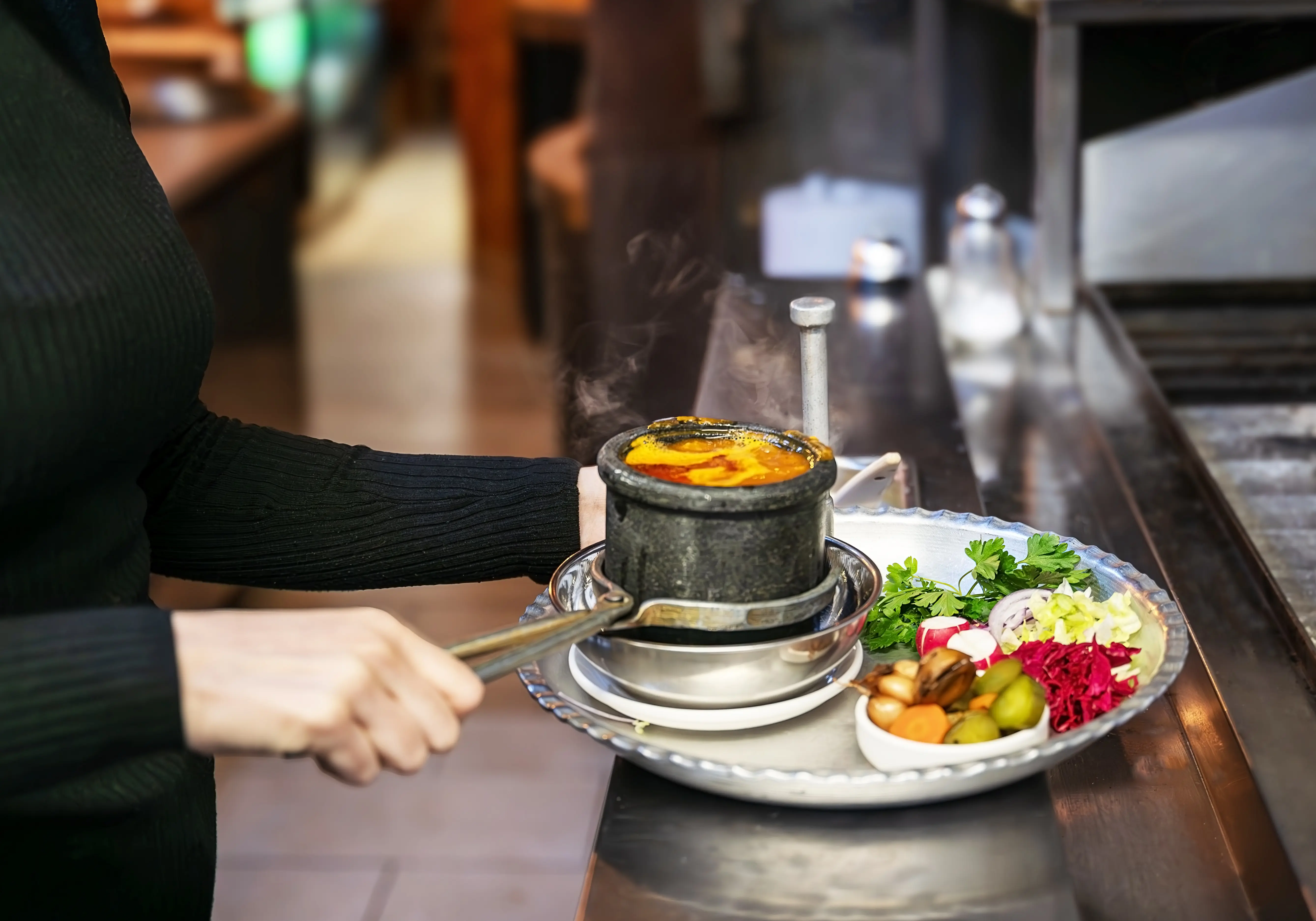 Traditional Persian Dizi stew served at Sams Master Grill, a hearty and flavorful dish.