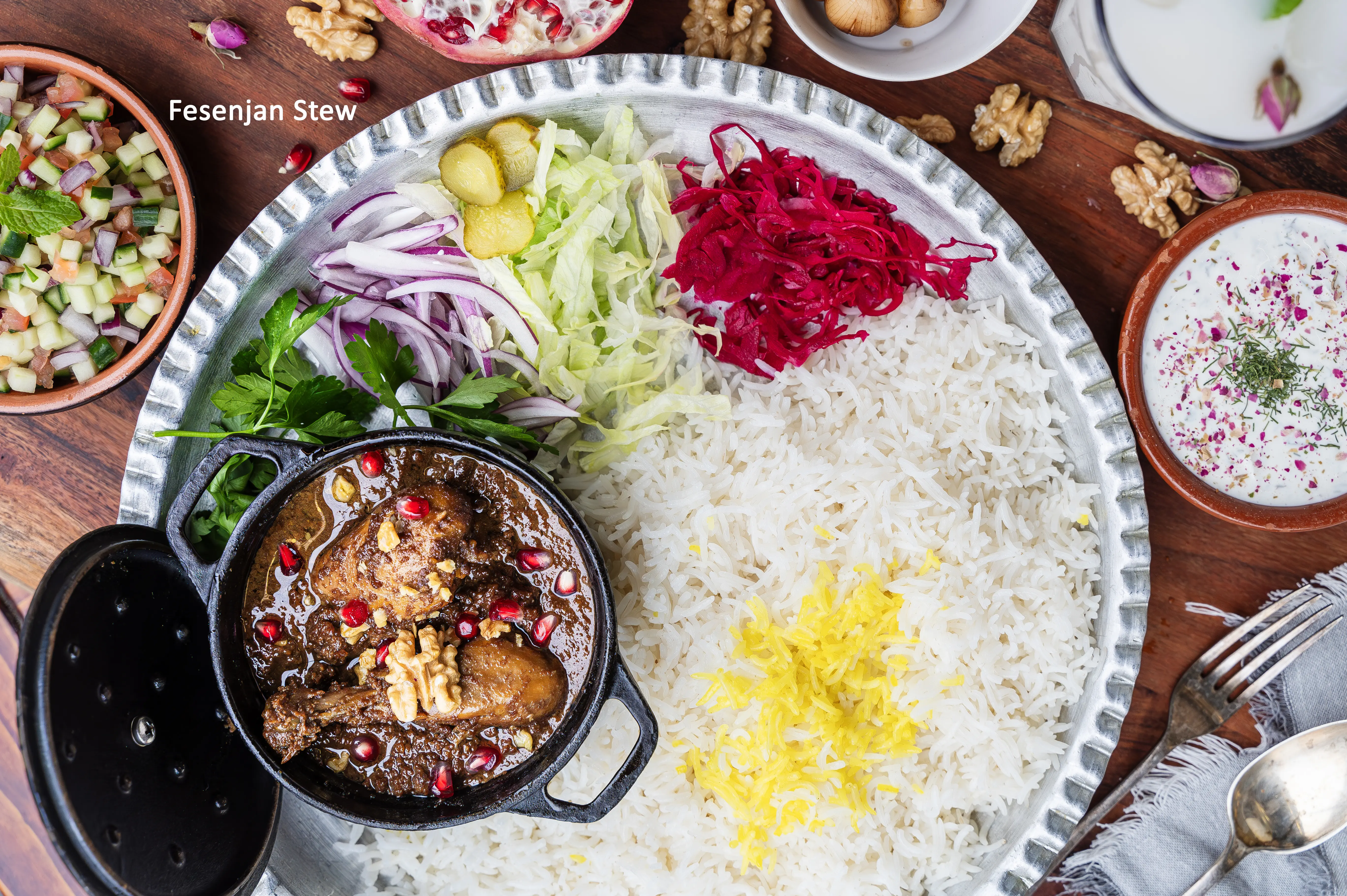 Authentic Persian Fesenjan stew served at Sams Master Grill, made with pomegranate and walnut for a rich, tangy flavor.